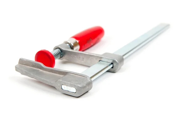 Металлический порок с красной ручкой на белом фоне — стоковое фото