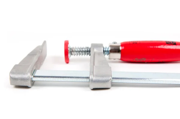 Stock image Metal vice with red handle on white background