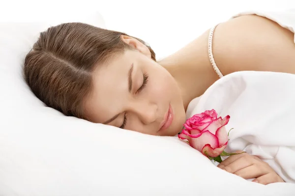 Spící dívka s květinou — Stock fotografie