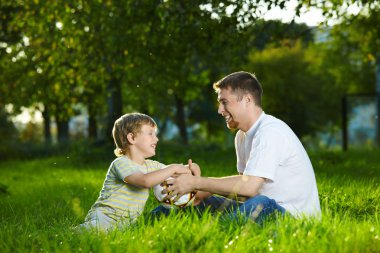 Daddy and son at a ball clipart