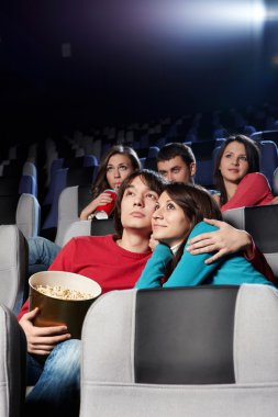 Enamoured couple at cinema clipart