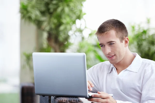 Attractive man with laptop — Stock Photo, Image