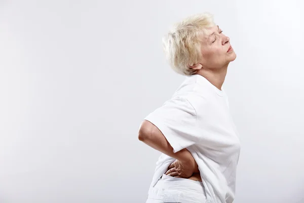 Eldery woman with pain — Stock Photo, Image