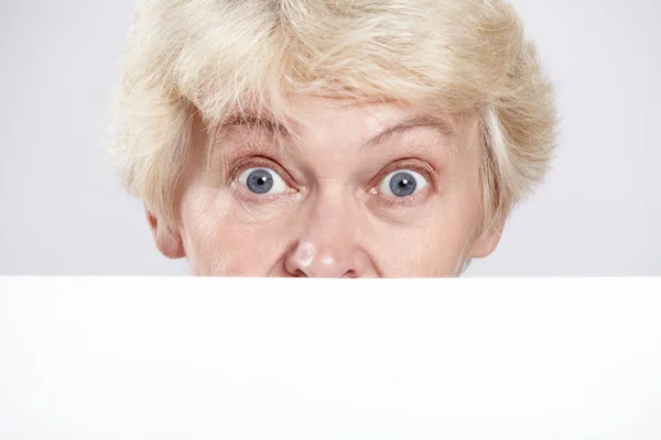 Mature Woman Surprised Eyes Blank Form Closeup — Stock Photo, Image