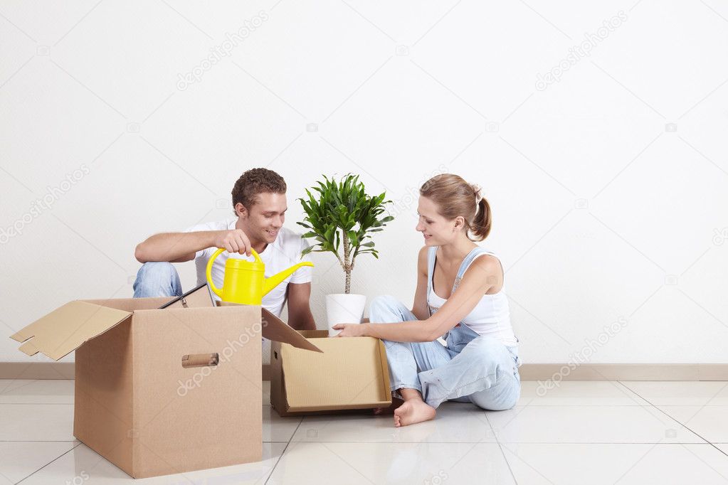 Young couple unpacked on the floor