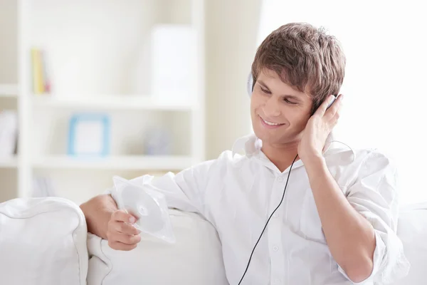 Smiling Man Listening Music Sees Disc — Stock Photo, Image