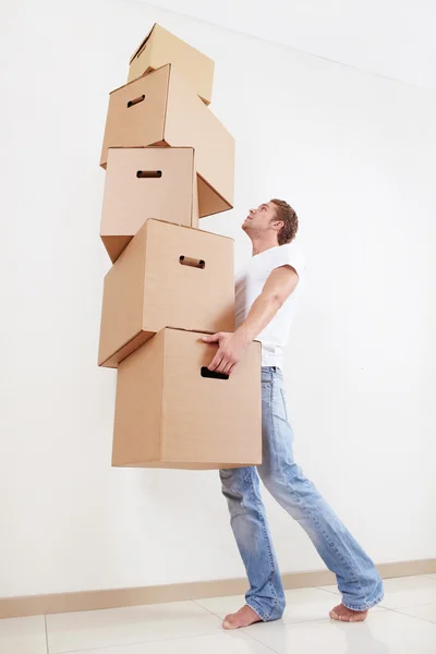 A young man with a cardboard box — Stock Photo, Image