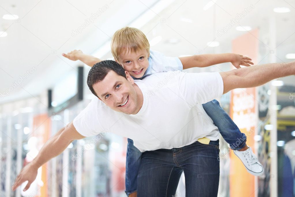 Father and son have fun in store