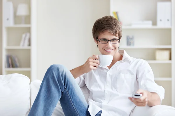 Young Man Watching Couch — Stock Photo, Image