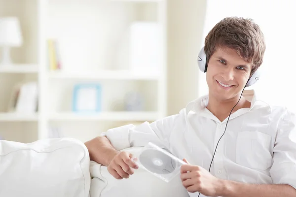 Attractive Man Disk His Hands Listening Music Headphones Sofa — Stock Photo, Image