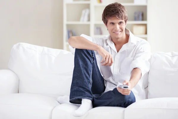 Young Man Remote Control Hands Changes Channels — Stock Photo, Image