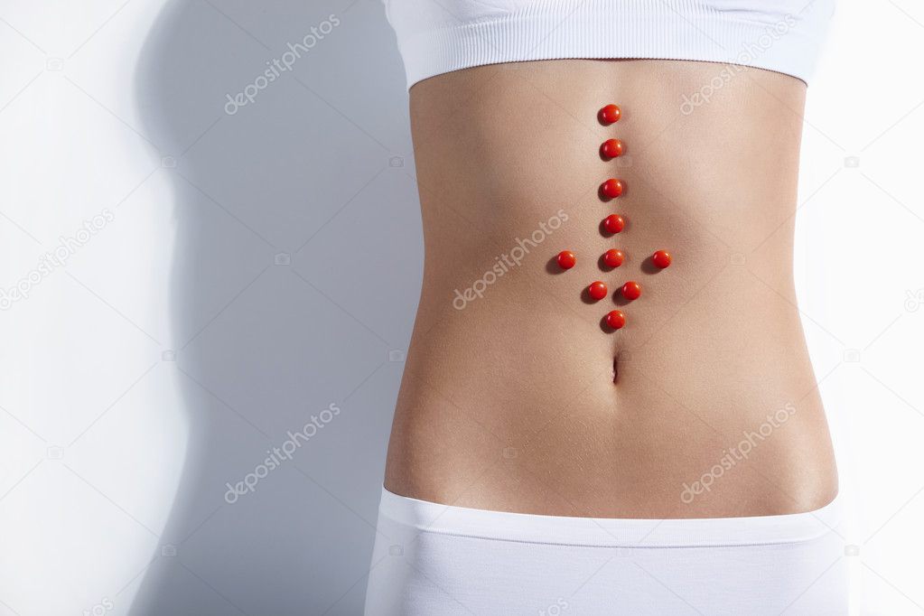The red arrow on the stomach