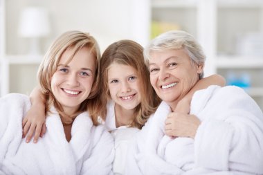 Three generations of women in the home clipart