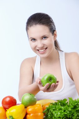 Young attractive girl offers an apple clipart