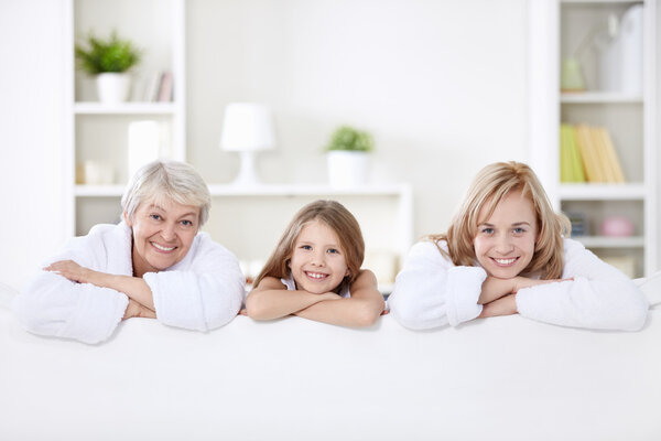 Three generations of women on the couch at home