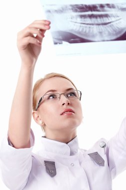 Attractive nurse with X-ray clipart