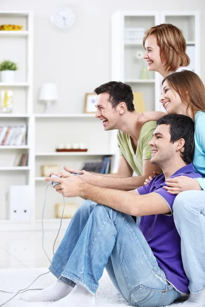 Young friends playing games — Stock Photo, Image