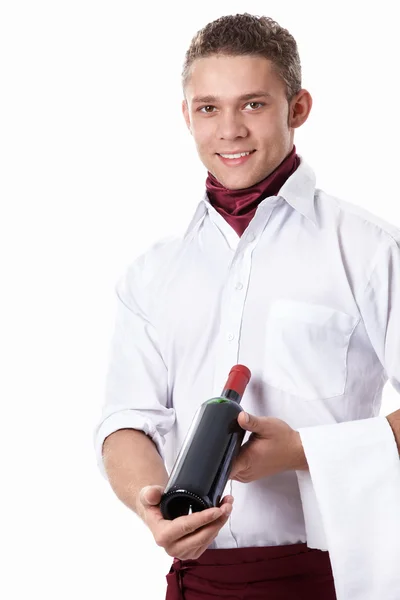 Um empregado com uma garrafa de vinho — Fotografia de Stock