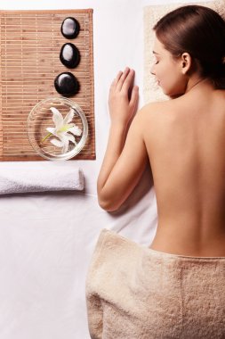 Young naked girl doing spa treatments clipart