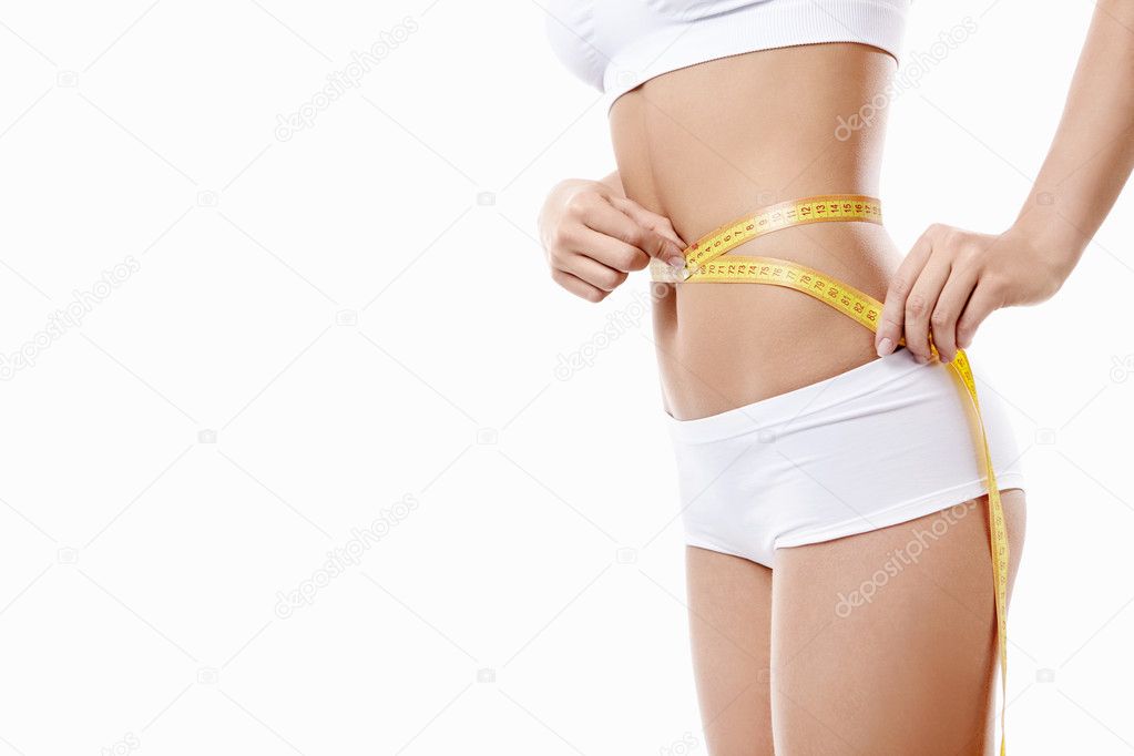Young girl measuring waist