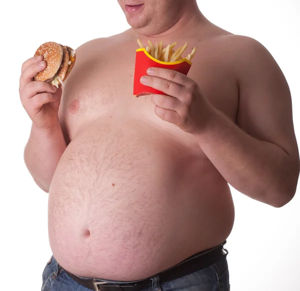 Tlustý muž s hamburger — Stock fotografie