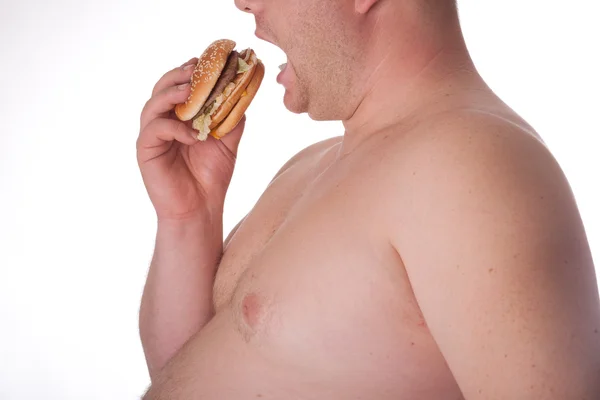 Fat man met hamburger — Stockfoto
