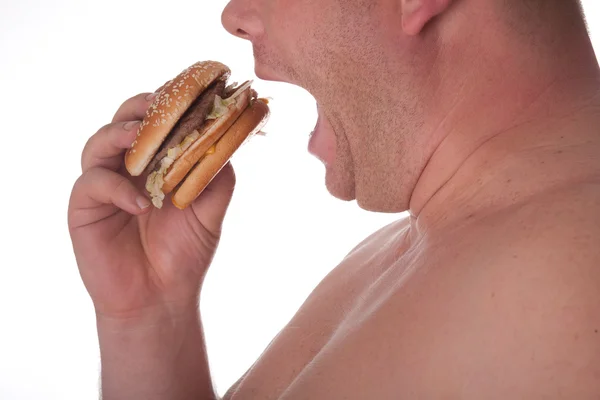Fat man met hamburger Stockfoto