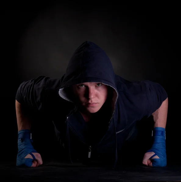 stock image Male kickboxer doing push-up on his knuckles