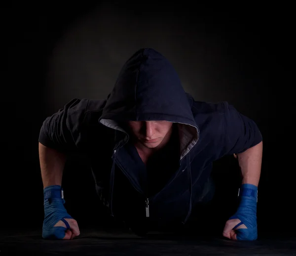 Kickboxer doing push-up on his fists — Stock Photo, Image