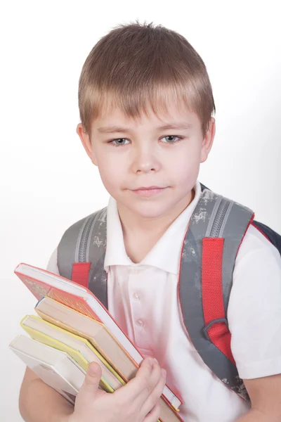 Schoolboy with books and backpack — Stock Photo, Image