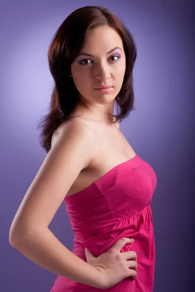 Stock image Attractive woman portrait on purple background