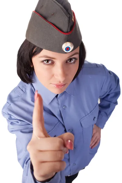 stock image Young woman wearing a russian police uniform pointing her finger