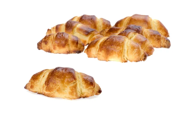 Čerstvý croissant izolované na bílém pozadí — Stock fotografie