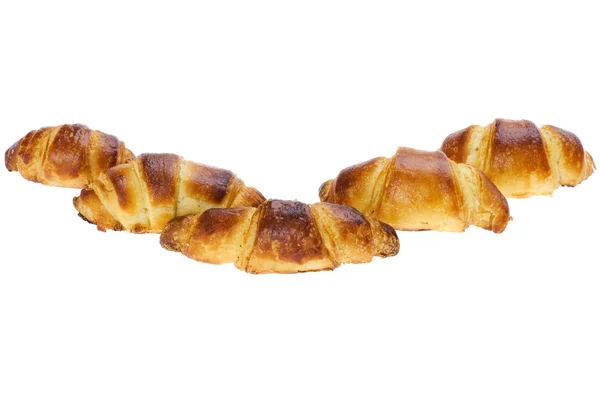 Frisches Croissant auf weißem Hintergrund — Stockfoto