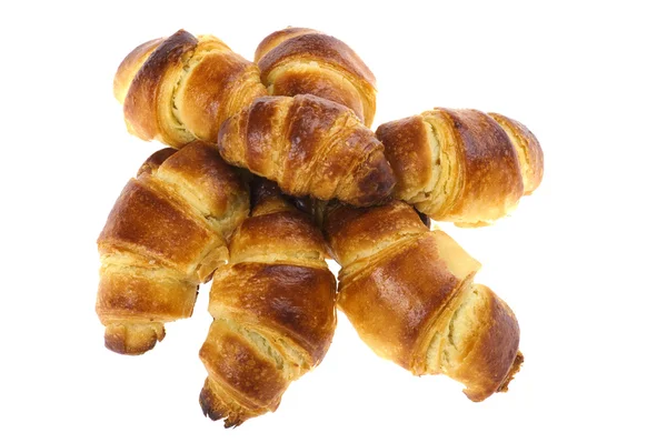 Frisches Croissant auf weißem Makro — Stockfoto