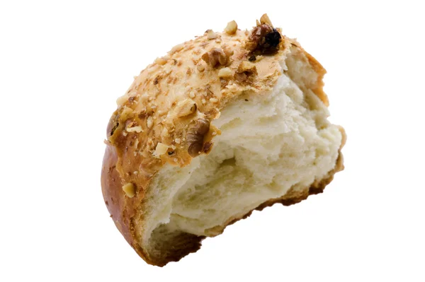 Bun with nuts on white — Stock Photo, Image