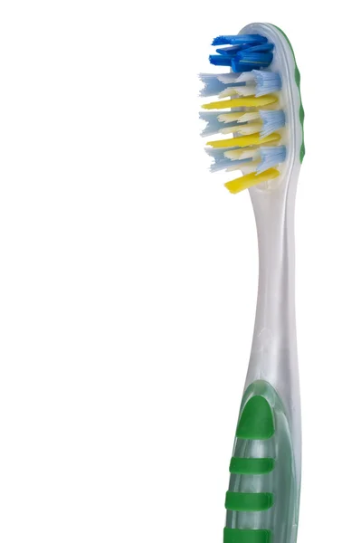 Cepillo de dientes en blanco de cerca —  Fotos de Stock