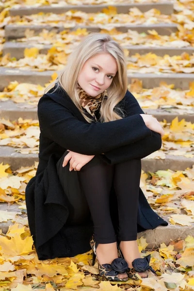 Autumn girl on the stairs — Stock Photo, Image