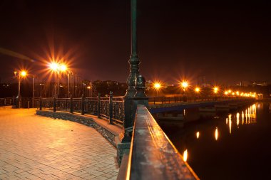 Night bridge over the river Kalmius.Donetsk.Ukraina clipart