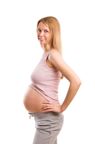 Piękna młoda w ciąży blond dziewczyna na białym tle — Zdjęcie stockowe