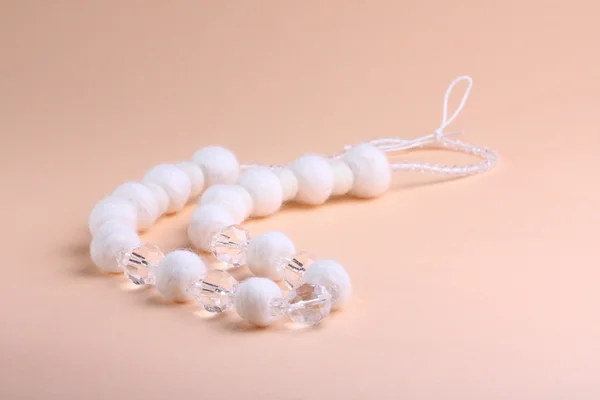 White beads at pink background — Stock Photo, Image