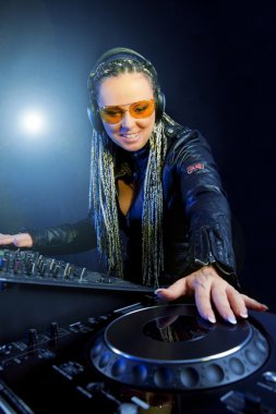 Dj woman playing music by mixer clipart