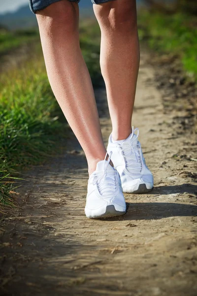 Woman walking cross country and trail — Stock Photo, Image