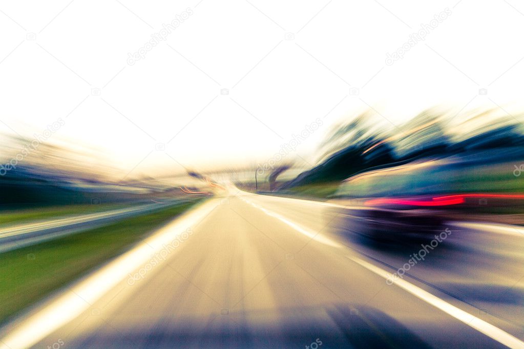 Fast moving car on highway