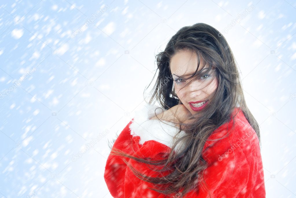 Happy female Santa in snowstorm