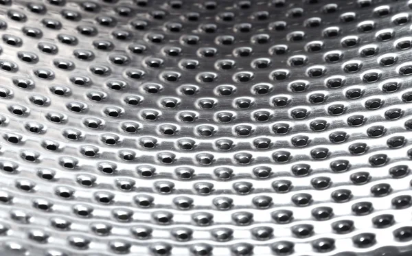 stock image Close-up photo of the metal pattern with perforated holes