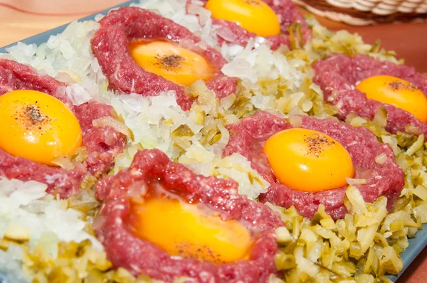stock image Tartar steak with egg onion and pickle