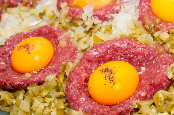 stock image Tartar steak with egg onion and pickle