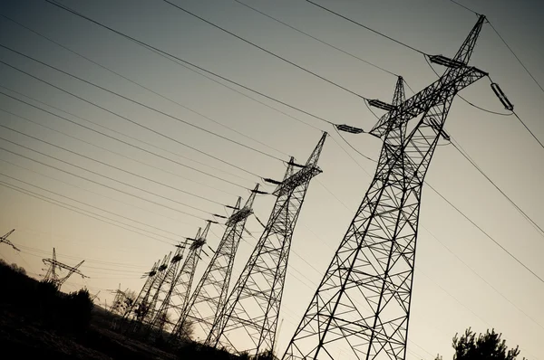 Pylon and transmission power line in sunset — Stock Photo, Image