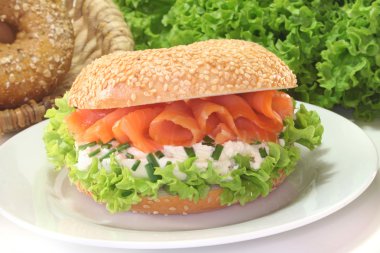 Bagel with cream cheese and salmon clipart